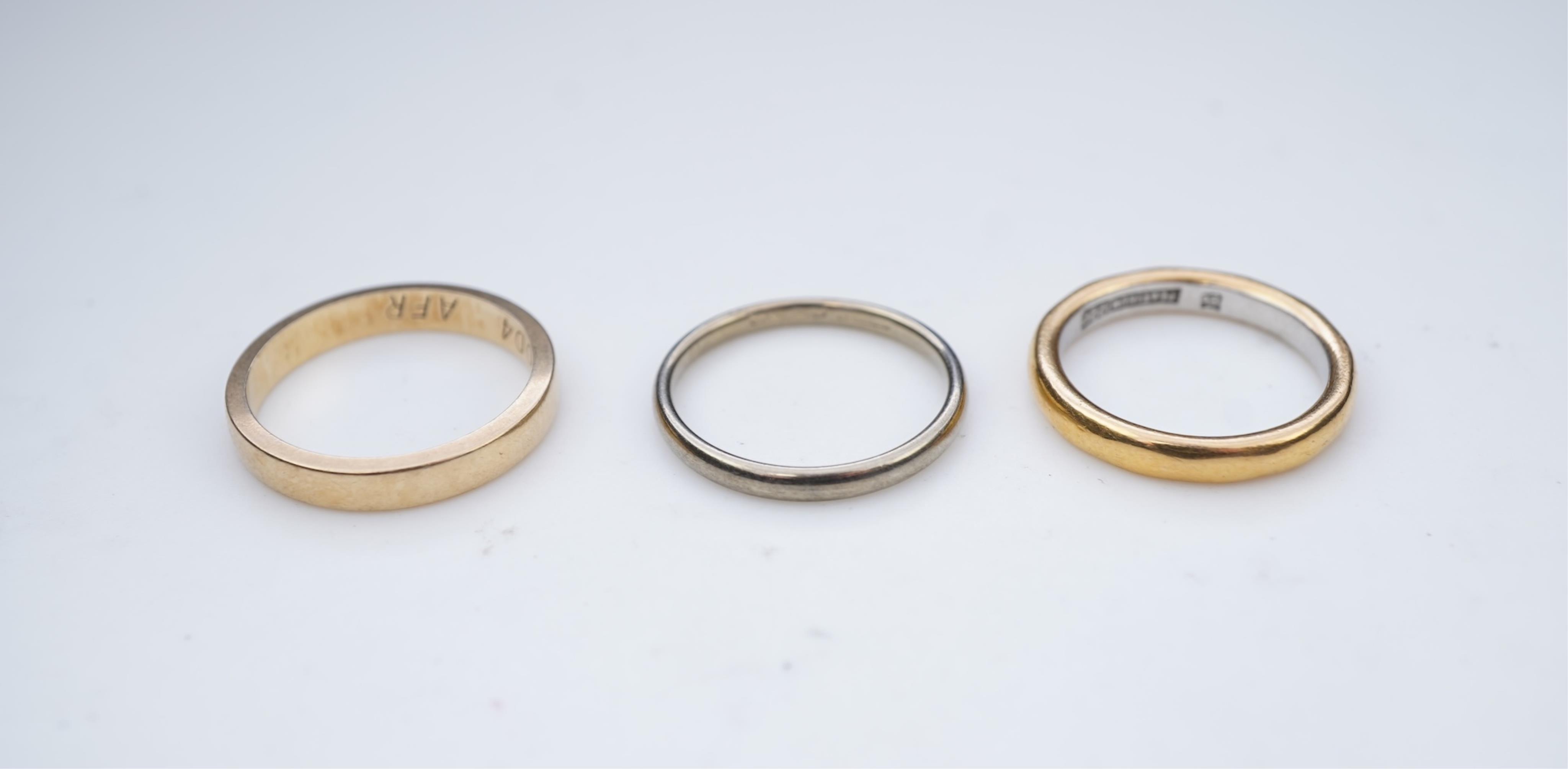 A collection of six gold wedding bands